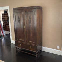 Old Armoire Converted Into Entertainment Center