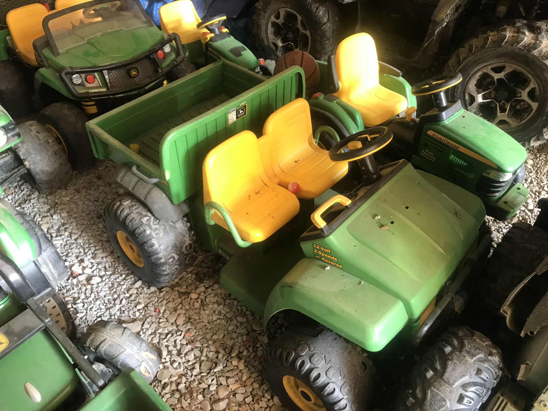 Several John Deere power wheels and jeep
