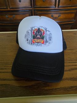 Black and white Skunk Ape Events trucker hat featuring a "Skunk Ape's Revenge" graphic.