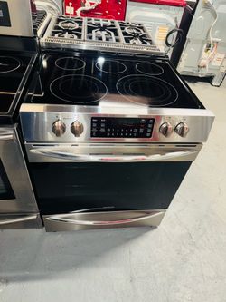 Frigidaire electric stove (stainless steel)—includes a receipt for a 90-day warranty.