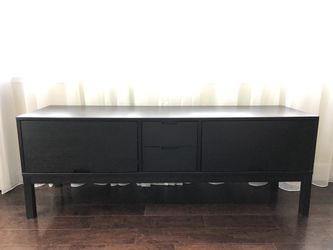 Black wood veneer TV console. 63”L x 18”D x 22.5”H.