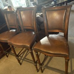 Three Leather Chairs