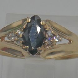 10KT YELLOW GOLD RING SIZE 6.75 2.8 GRAMS 6 DIAMONDS 1 BLUE STONE. 878718-4. 
