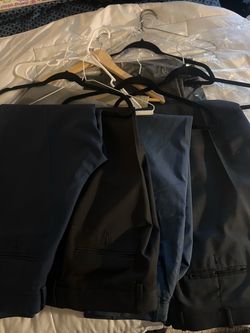 8 Pairs of Men’s Premium Dress Pants — $35 LOT