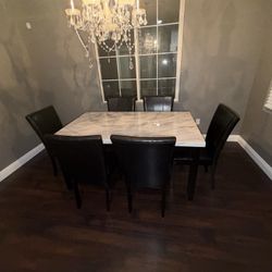 Faux Marble Gray Dining Table With Six Black Leather Chairs