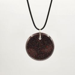 Stardust V Orgonite Pendant, Provides EMF Protection, And  Balance. 

Contains: 
Red jasper, black obsidian, metal, and resin. 

"Embark on a journey 