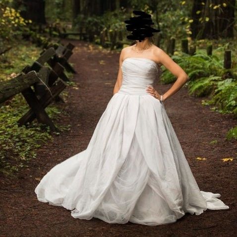 white by vera wang textured organza wedding dress Vera Wang Haute Wedding 2023 Collection Ariel Light ivory French tulle mock neck gown with a hand draped spiral design and accented by a light ivory silk organza flower at the neck