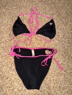 Victoria's Secret heart cut-out bikini features a black and pink design with adjustable side ties size S