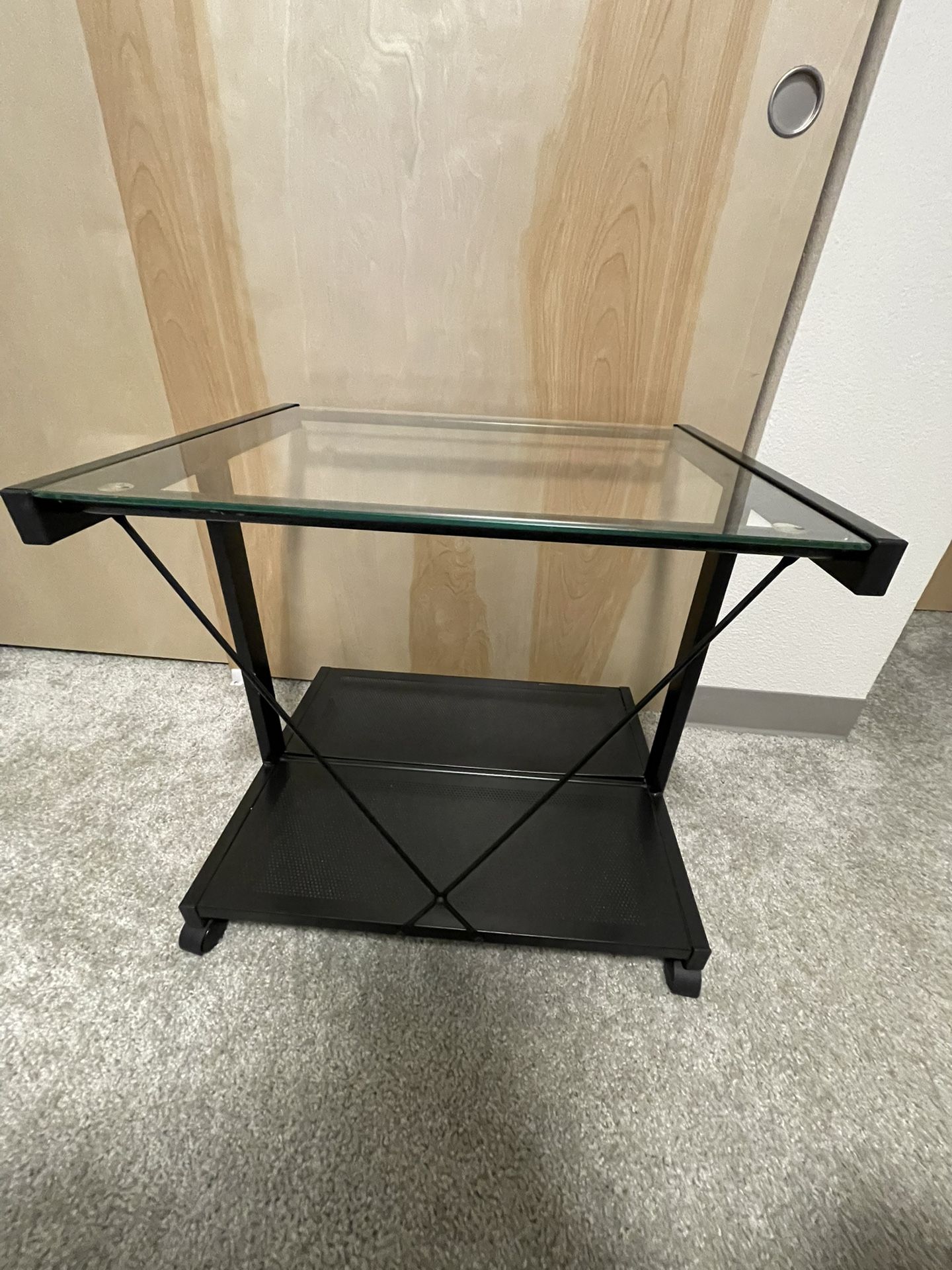 Metal table with the glass top