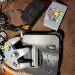 Nintendo 64 console with super mario 64 game , controller,  av cord and power cord working perfectly