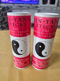 Two sets of new never used fortune telling sticks with explanation.