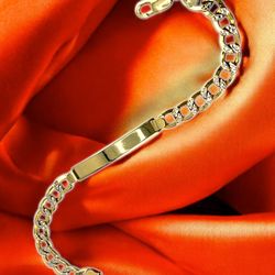14kt 11.30g Yellow Gold ID Curb Día Cut Bracelet.