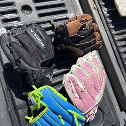 Child and adult baseball gloves, and adult and youth helmets