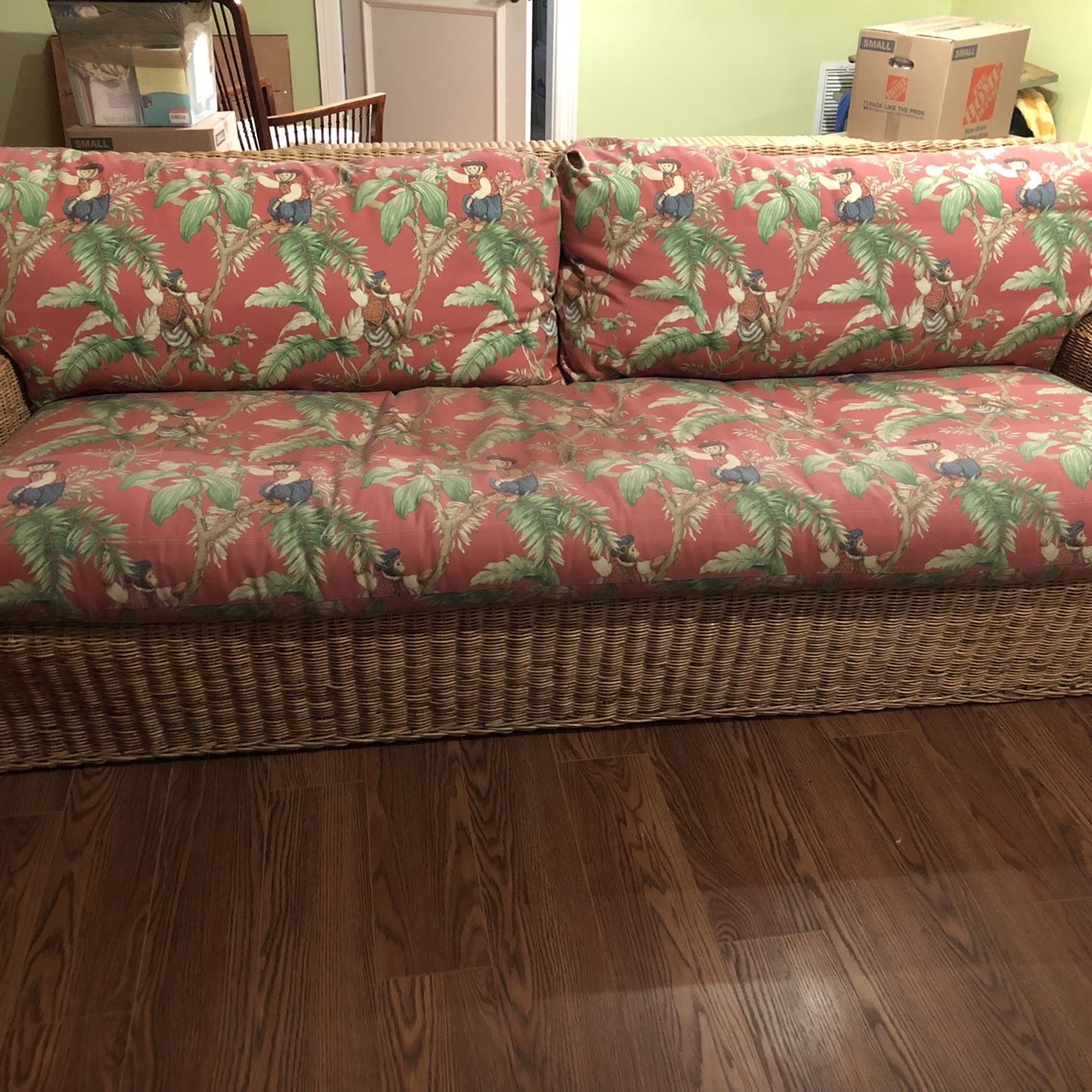 2 Rattan Couches With Red Monkey Fabric
