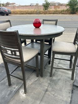 Gray table and four chairs