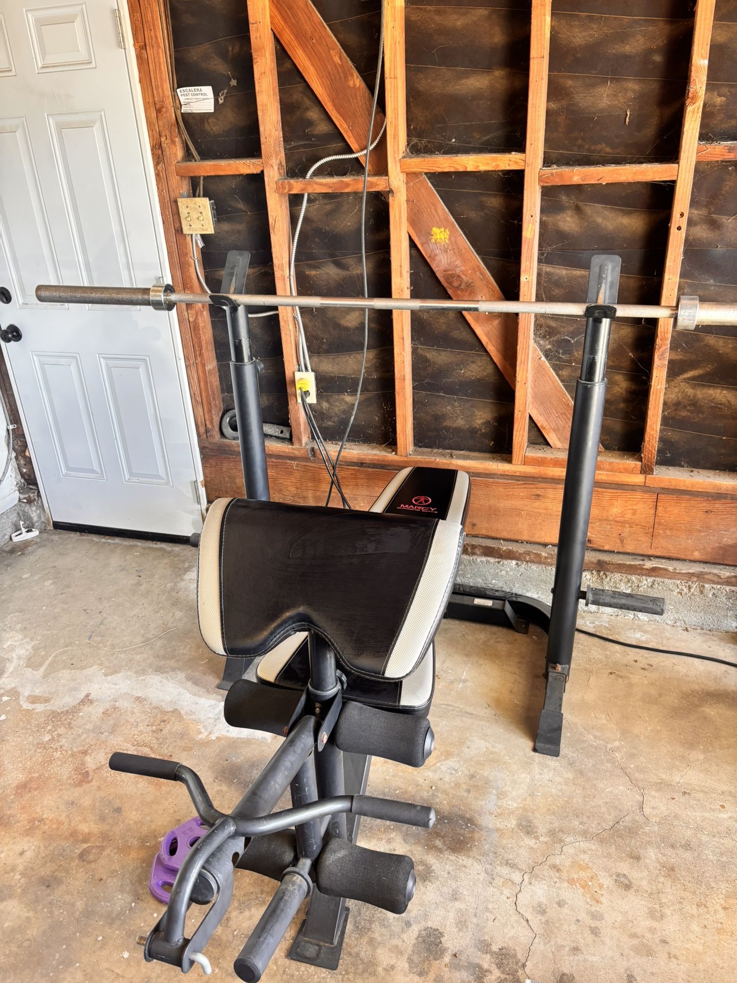 Marcy Weight Bench With 45lb Bar and bar Clips.