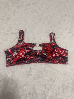Bold mushroom print crop top with a center keyhole detail. Stretchy fabric for a snug, comfortable fit. Playful graphic pattern for festival-ready sty