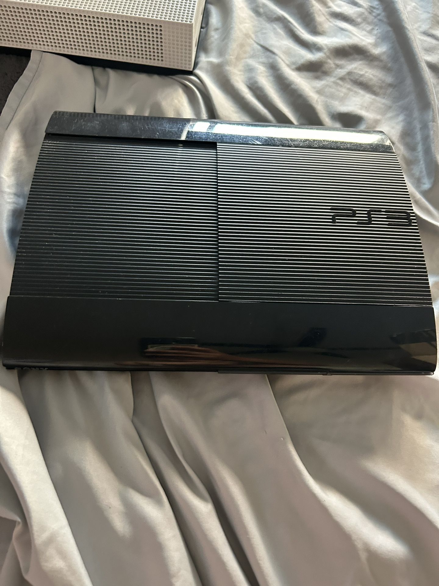 PS3 Super Slim Great Condition Comes With Lots Of Games And Controller All Wires Included