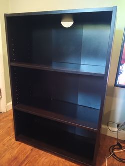$10 Bookcase dark wood laminate in good condition