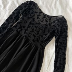 Size M. Beautifully Detailed Long Sleeve Fitted and Flare Black Dress. New, never used.