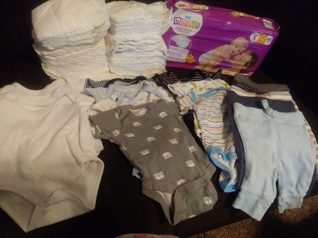 Newborn Onesis & 2 packs of size 1 diapers never used