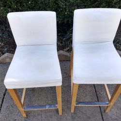 Two Bar Stools From The Bottom To Top Three Feet