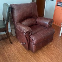 brown rocking chair with leg rest