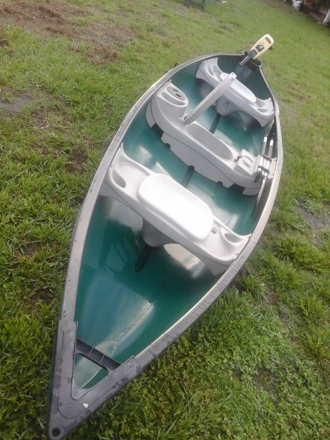 Tons of summer fun, excellent condition!! 15.6 ft Sundolphin Mackinaw SS canoe with 2 paddles, trolling motor and battery.