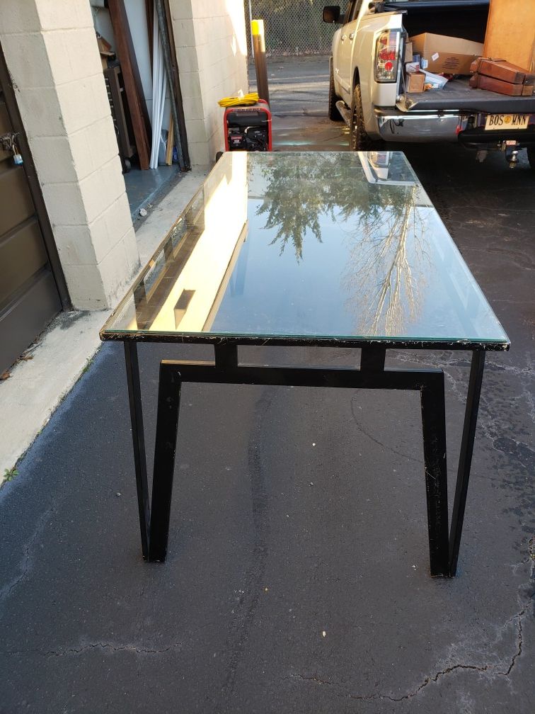 Glass and black iron dining table