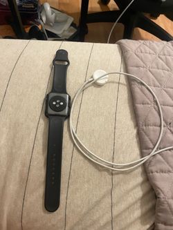Apple Watch Series 3 with charger and screen protector
