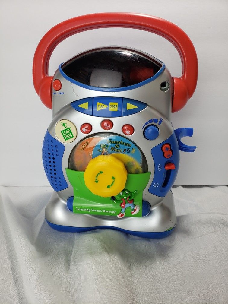 Leap frog learning screen karaoke/Boom box no microphone. Measures 12 x 11.4 x 6.2 inches. Works just needs the microphone. Smoke free home.