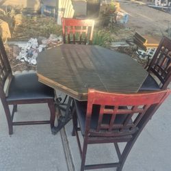 octagonal poker and dining set featuring a wooden table and four matching chairs. 