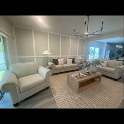 Three piece beige sofa set