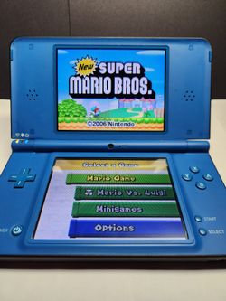 NINTENDO DSI XL COMPLETE WITH STYLUS AND CHARGER 