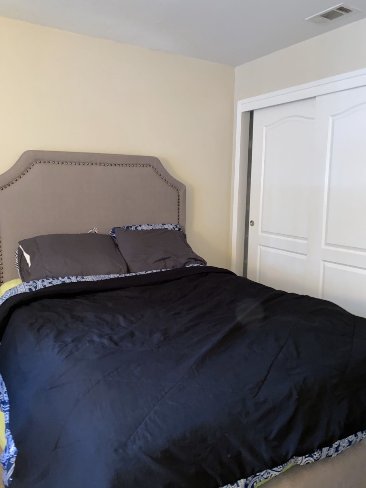 Bedframe With Grey Cloth Headboard