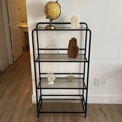 Beautiful glass shelf or bookcase with black metal frame and gold detailed glass