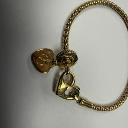 Authentic Pandora gold-plated bracelet with charm.