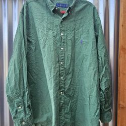 Ralph Lauren long-sleeve, button-down woven shirt in a solid green color. It features a classic casual silhouette with a button-down collar and a cont