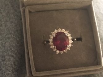 3 Ct oval ruby and white topaz ring