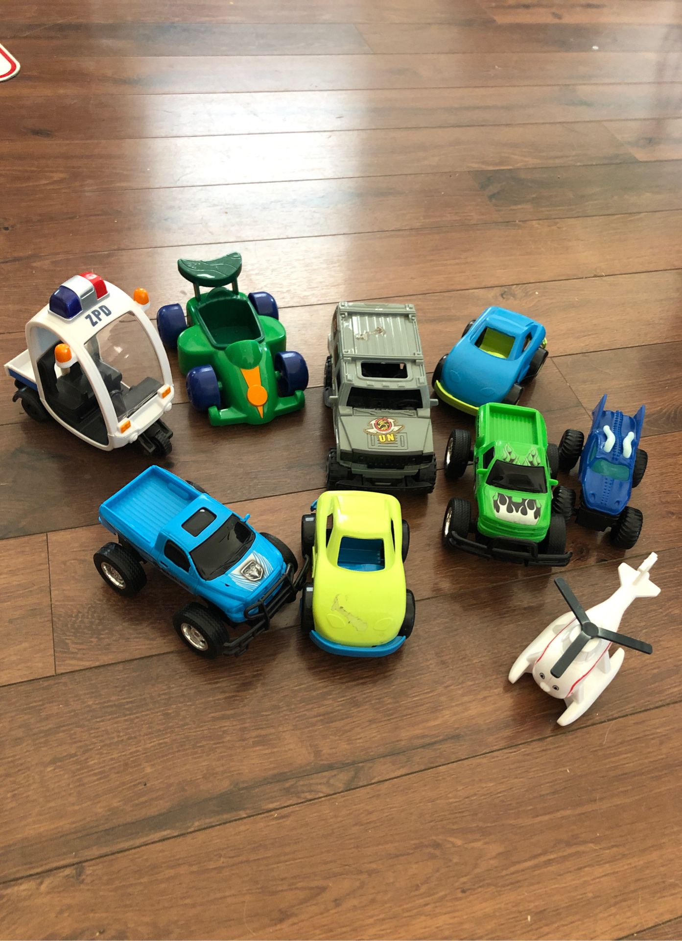 Monster trucks, Thomas the train helicopter, police car and race cars - 9 total