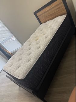 Selling a complete Twin size bed set. Solid wood frame with a modern panel design.