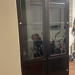Dark brown Wood Curio Or Display Cabinet With Shelves And Glass Doors