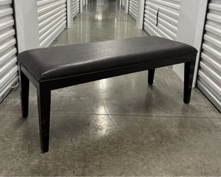 ESPRESSO BROWN FAUX LEATHER UPHOLSTERED PADDED WOOD BENCH IN VERY GOOD OVERALL CONDITION.