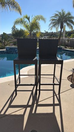 2 outdoor bar height wicker chairs
