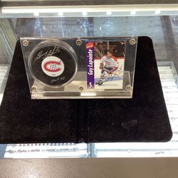 Autographed Guy Lapoint Hokey Puck