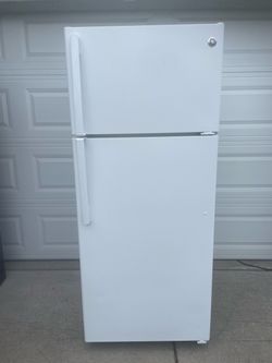 GE top and bottom refrigerator $260.  Dimensions are 28Wx30Dx67H. Pick up only.