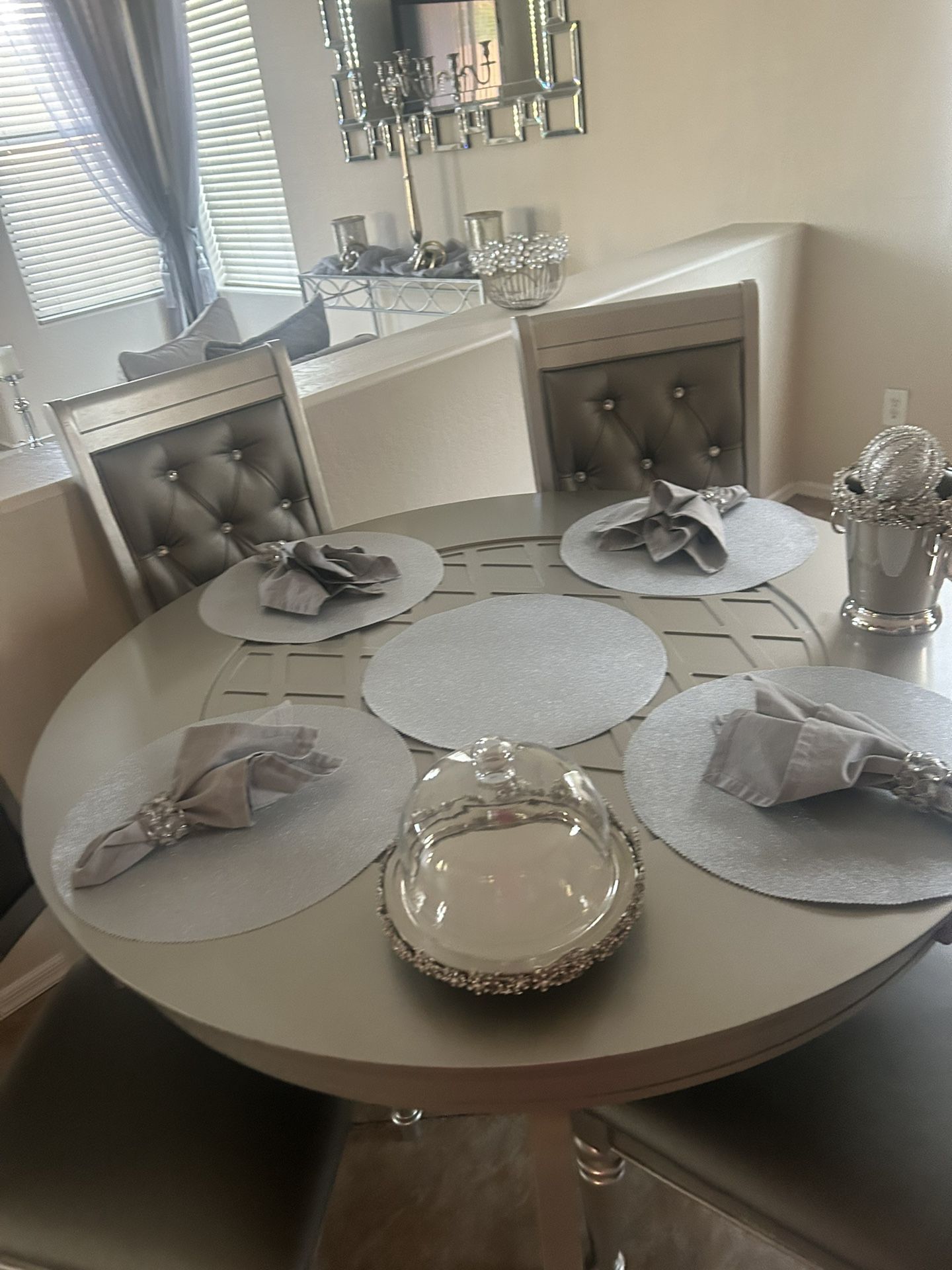 A table gray with four chairs