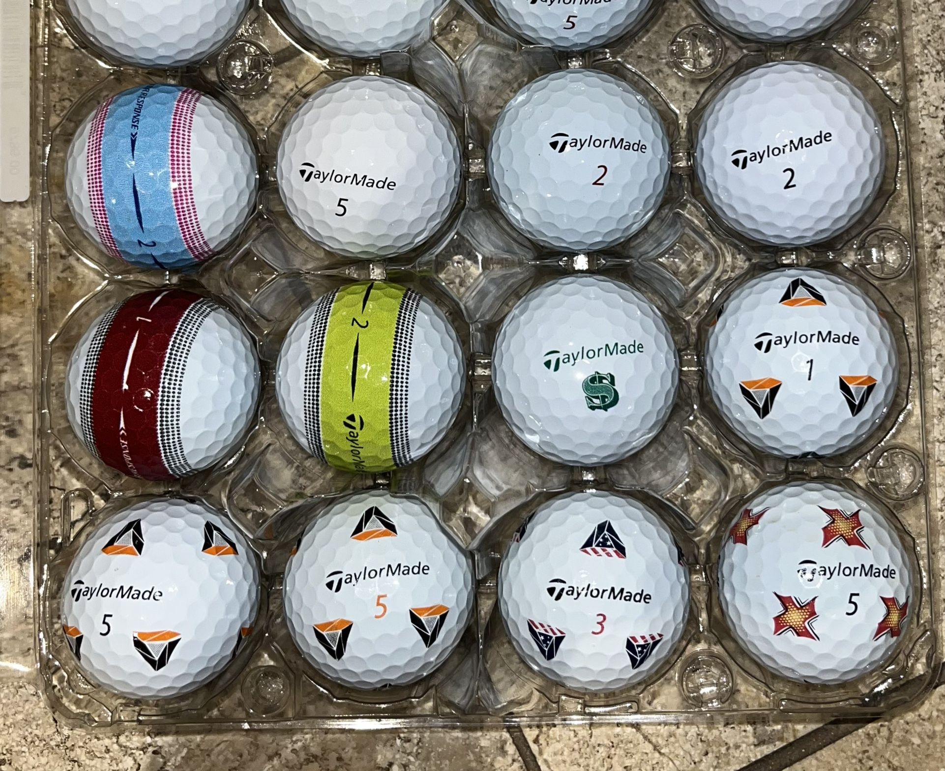 24 TaylorMade golf Balls As Pictured most are TP5, TP5X,and tour response ——