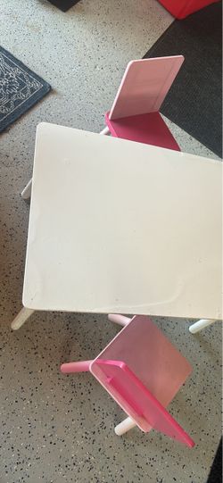 Kids table used white with two pink chairs