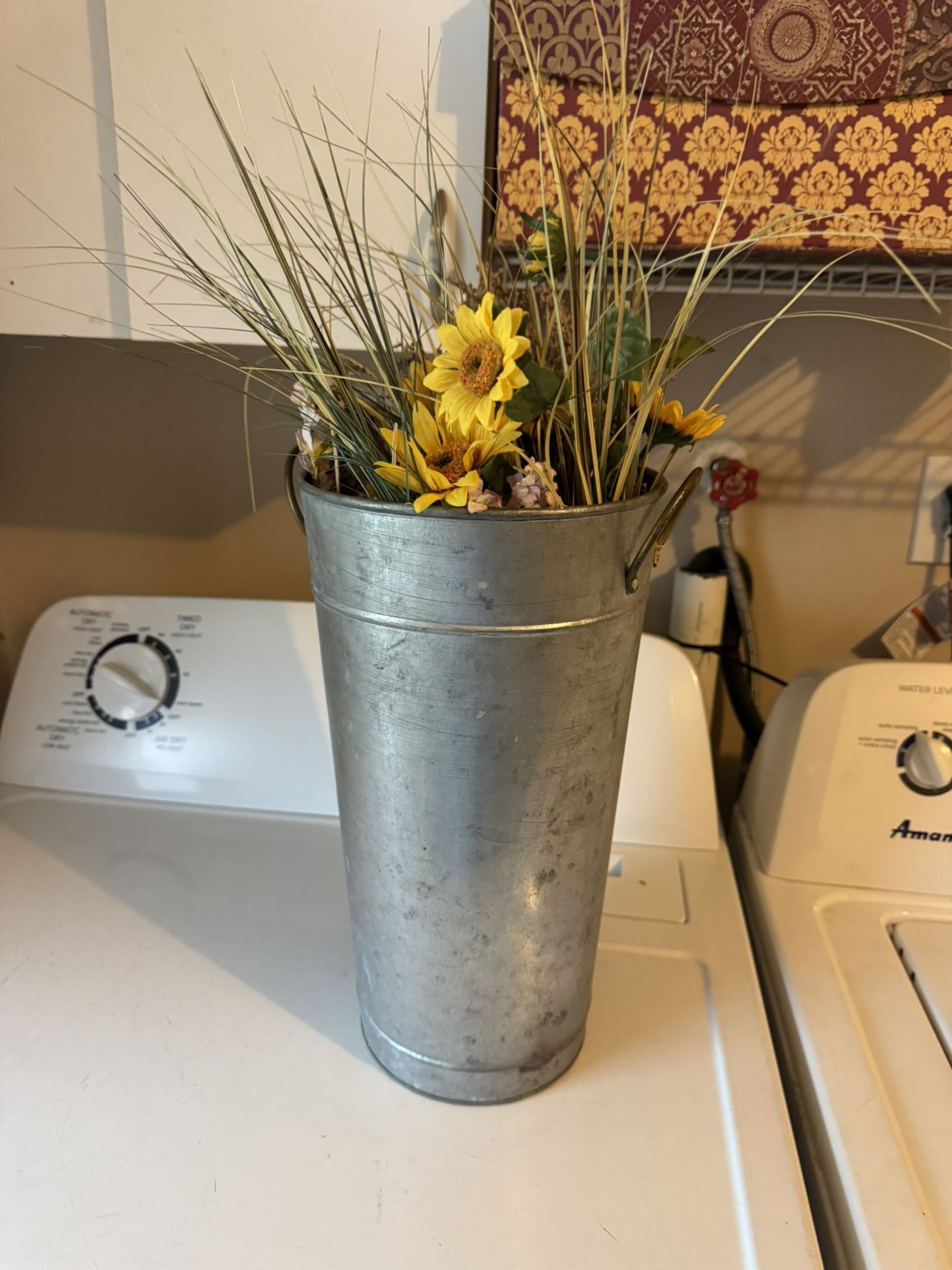 Galvanized pot with beautiful, fake flowers
